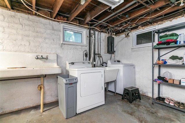 washroom featuring laundry area, a sink, independent washer and dryer, and electric panel