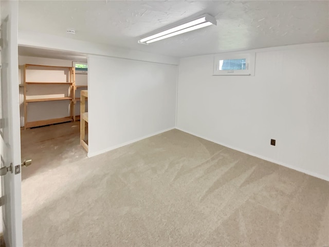basement with carpet floors and baseboards