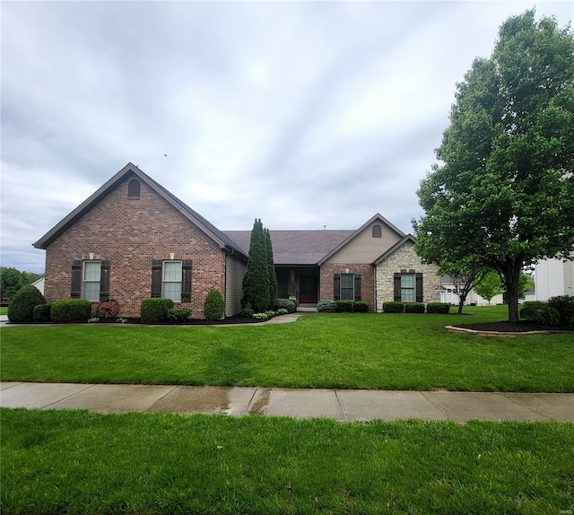 single story home with brick siding and a front lawn