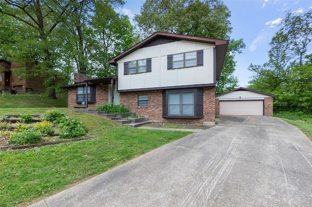 tri-level home with a detached garage, an outbuilding, a front yard, and brick siding