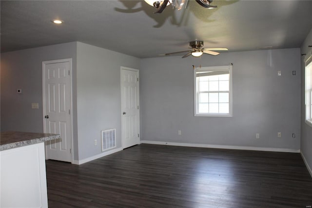empty room with visible vents, baseboards, dark wood-type flooring, recessed lighting, and a ceiling fan