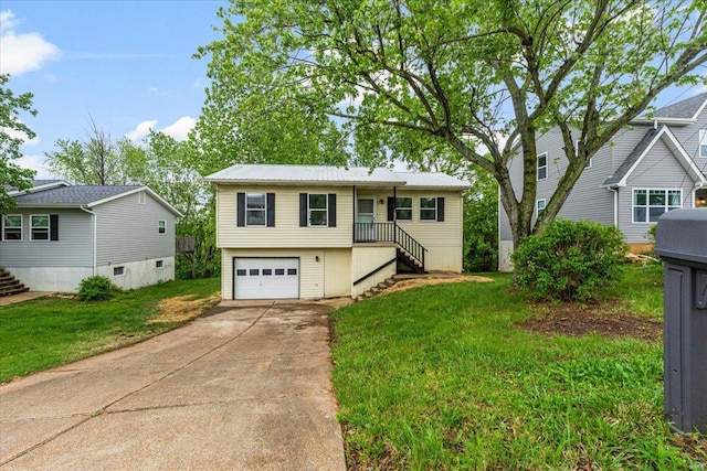 view of front of house with stairway, an attached garage, concrete driveway, and a front lawn
