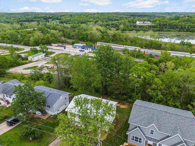 bird's eye view with a forest view and a water view
