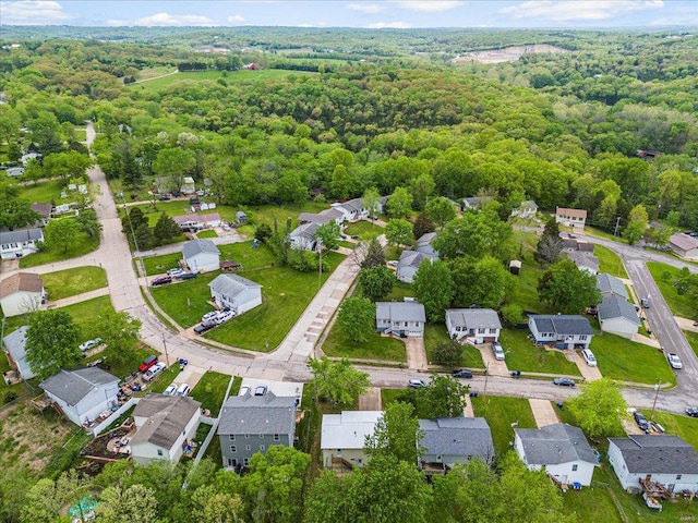 bird's eye view featuring a residential view and a forest view