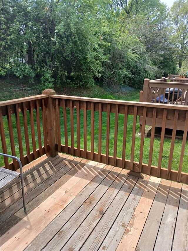 deck featuring a lawn