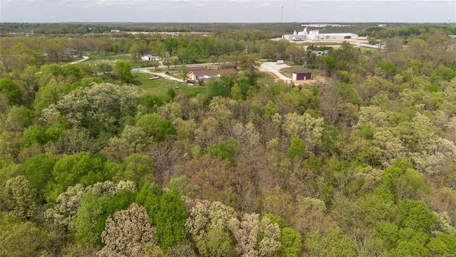 bird's eye view featuring a forest view