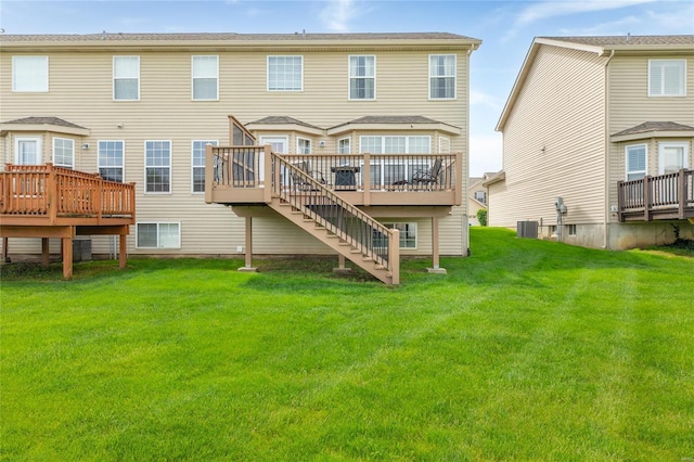 rear view of property with a wooden deck, stairs, a yard, and cooling unit