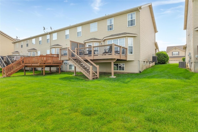 back of house with a lawn, a deck, central AC, and stairs