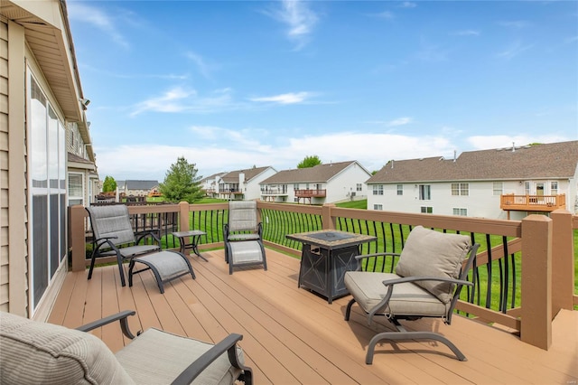 wooden deck featuring a residential view
