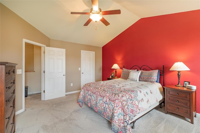 carpeted bedroom featuring baseboards, ceiling fan, and lofted ceiling