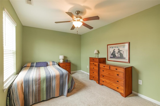 bedroom with visible vents, carpet flooring, baseboards, and ceiling fan