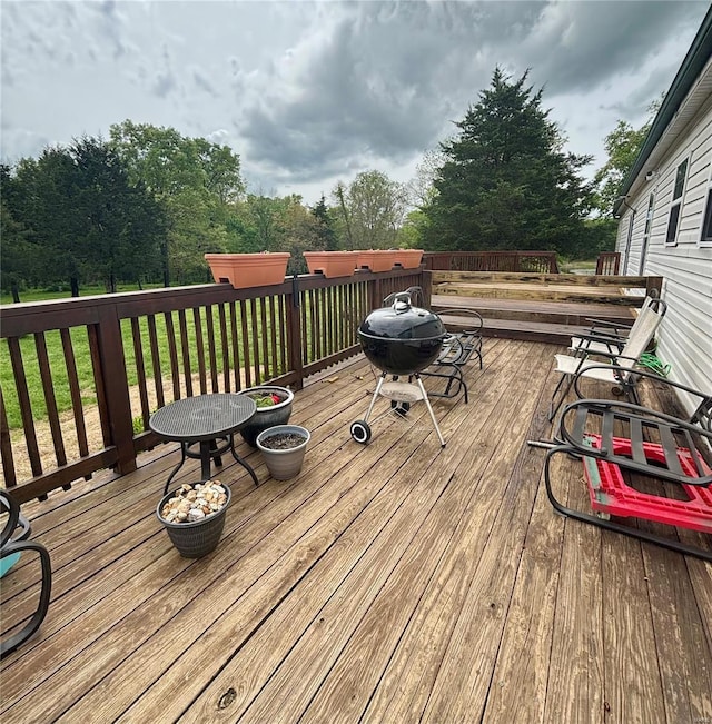 wooden terrace featuring area for grilling