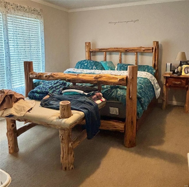 carpeted bedroom with crown molding