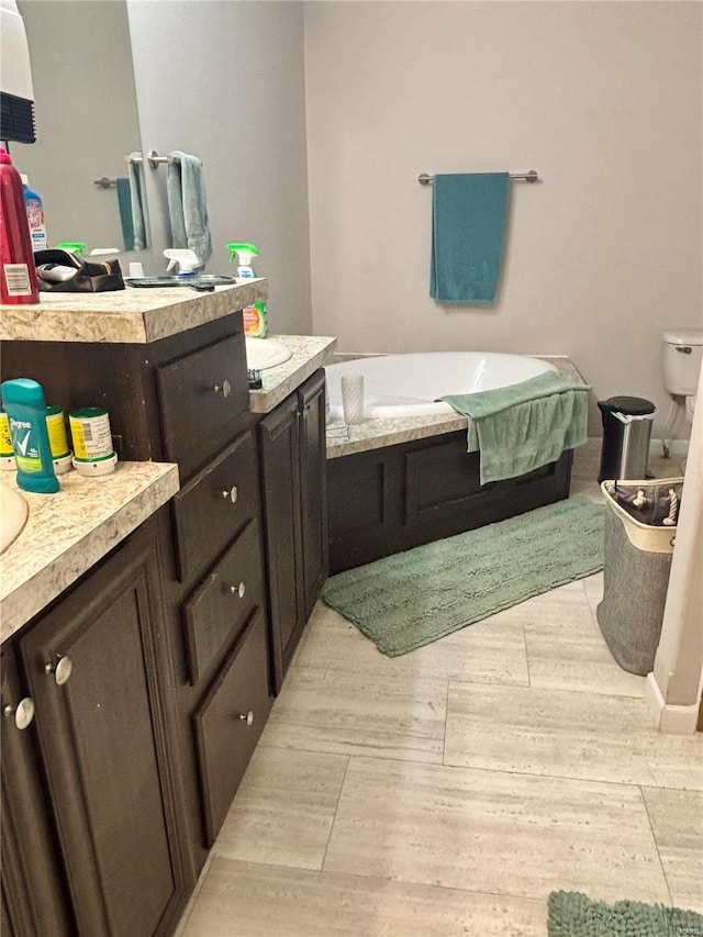full bath with a bath and wood finished floors