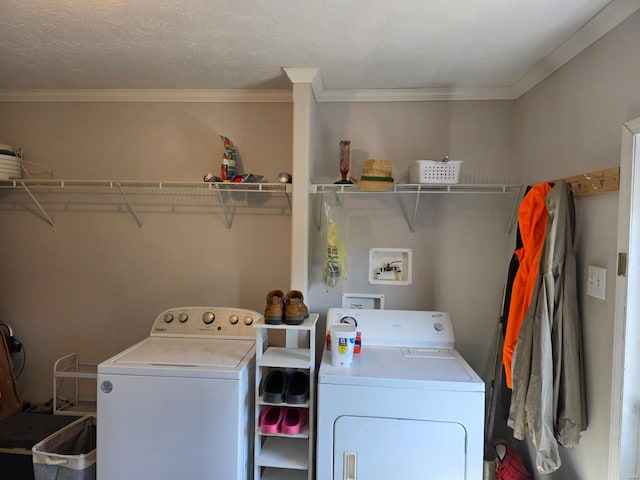 laundry room featuring independent washer and dryer, laundry area, and crown molding