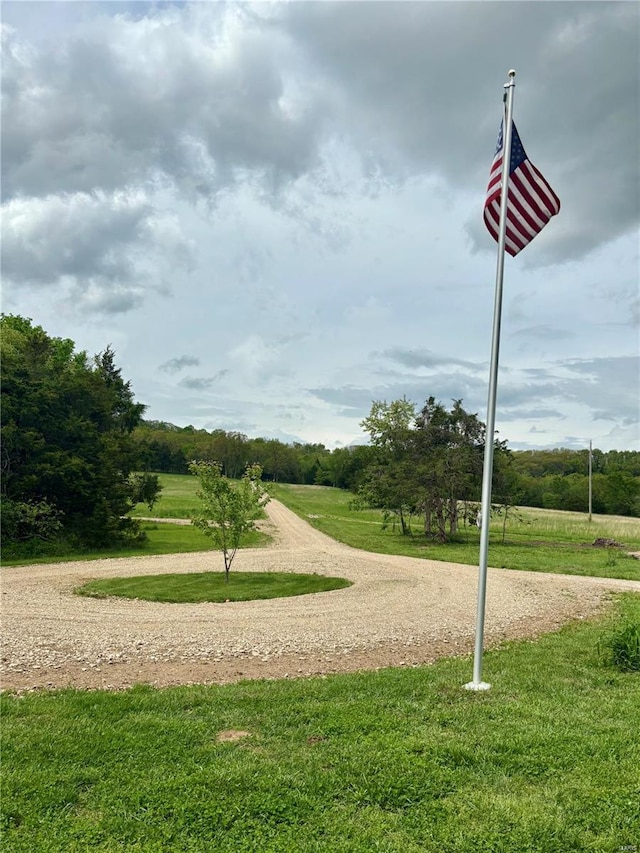 surrounding community featuring a lawn