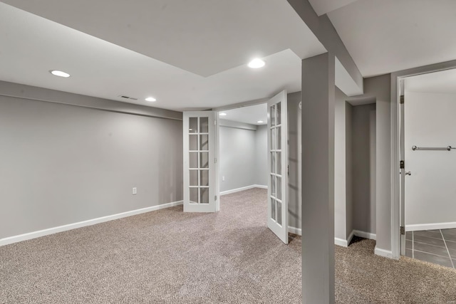 finished below grade area with carpet, french doors, recessed lighting, and visible vents