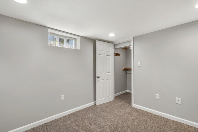 basement featuring carpet flooring, recessed lighting, and baseboards