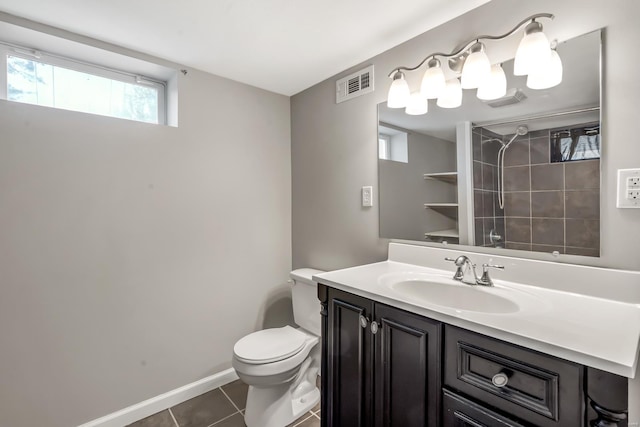 full bathroom featuring tile patterned flooring, vanity, toilet, baseboards, and visible vents