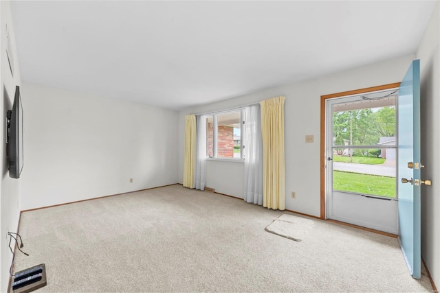 interior space featuring baseboards and a wealth of natural light