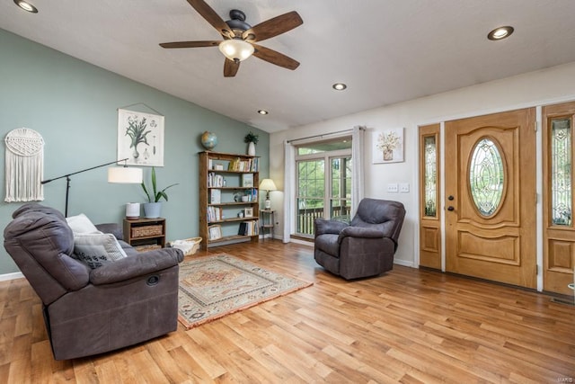 living room with recessed lighting, ceiling fan, vaulted ceiling, and wood finished floors