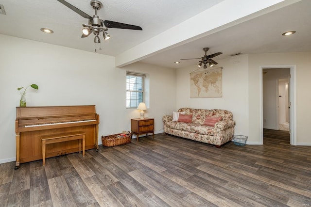 living area with baseboards, a ceiling fan, recessed lighting, and wood finished floors