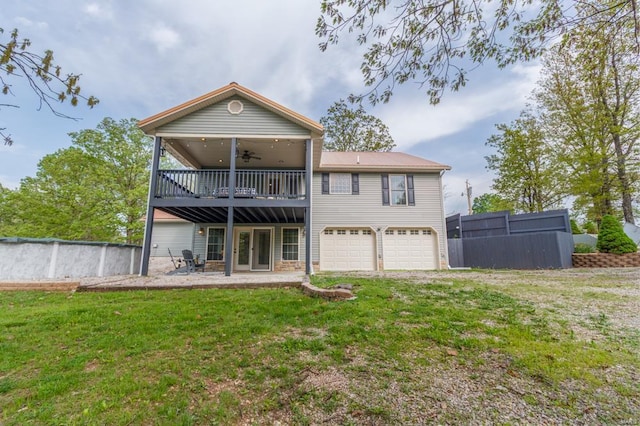 back of house featuring a ceiling fan, fence, a yard, a patio, and an attached garage