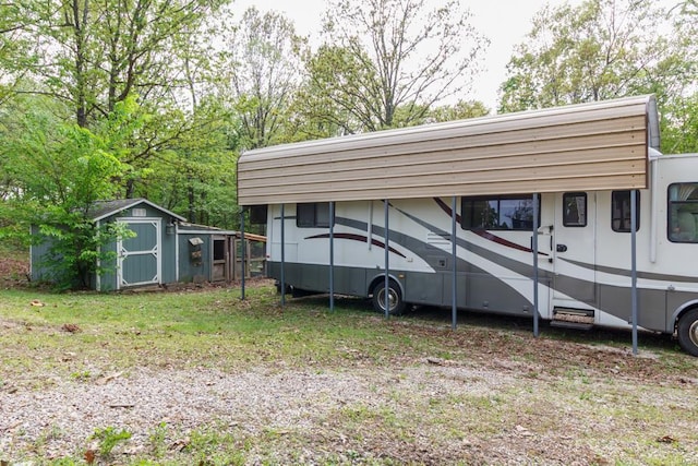 view of parking with a shed