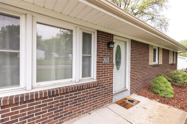 entrance to property with brick siding