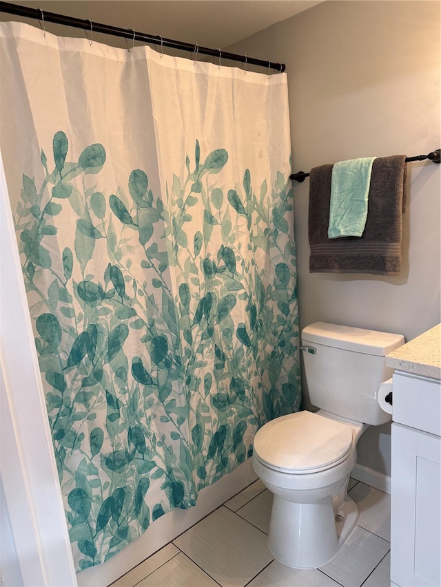full bath featuring vanity, tile patterned floors, toilet, and curtained shower