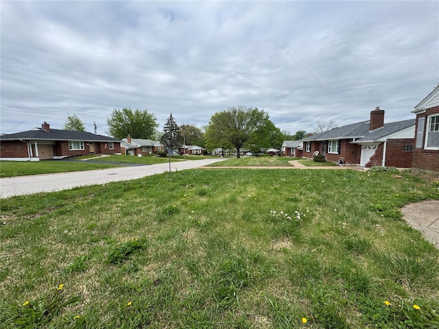 view of yard featuring a residential view