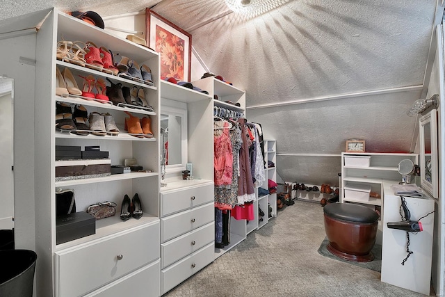 walk in closet with carpet
