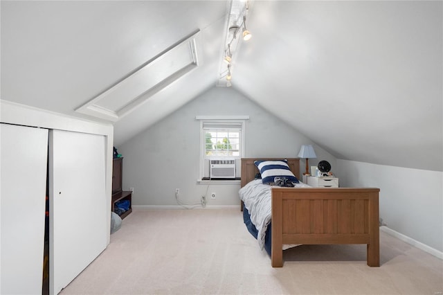 carpeted bedroom with baseboards, lofted ceiling, and cooling unit