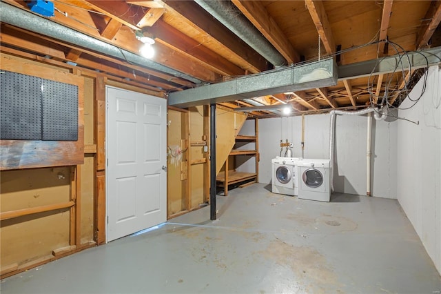unfinished below grade area featuring separate washer and dryer