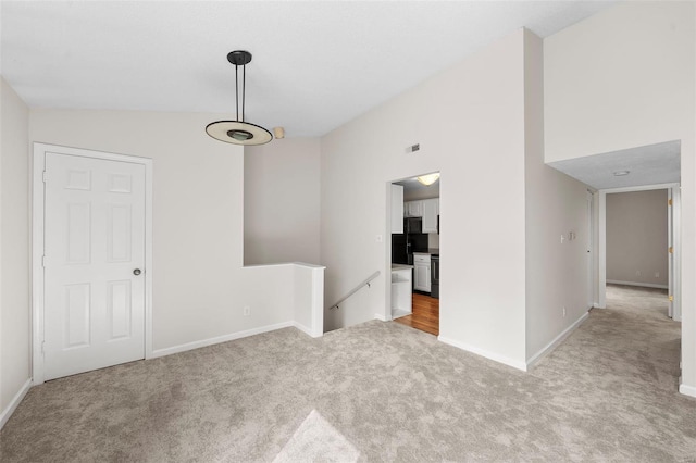 unfurnished room featuring baseboards, carpet, and visible vents