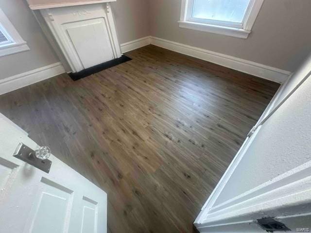 room details with baseboards and wood finished floors