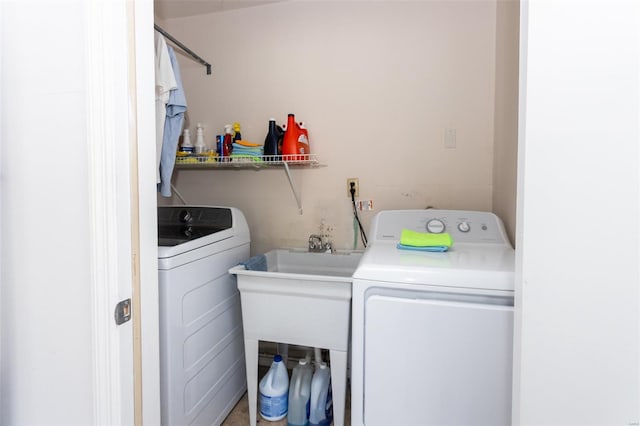 laundry area with separate washer and dryer and laundry area