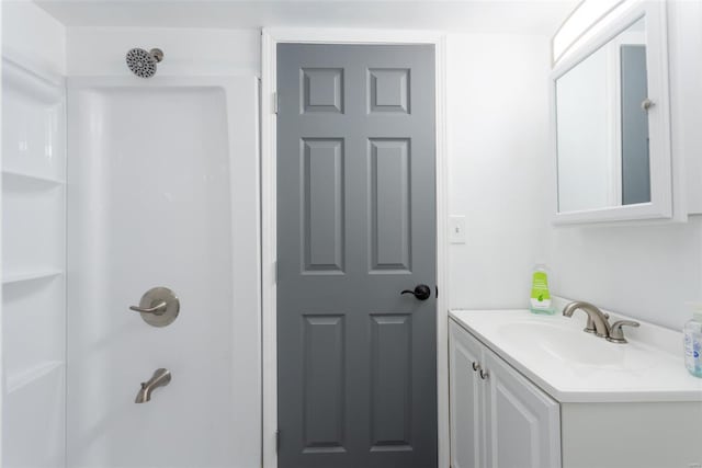 full bath featuring vanity and a shower