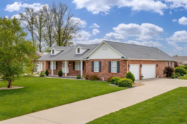 cape cod home with brick siding, a front lawn, an attached garage, and concrete driveway