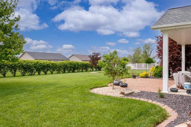 view of yard with a patio and fence