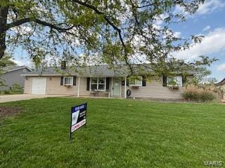 single story home featuring an attached garage, a front lawn, and concrete driveway