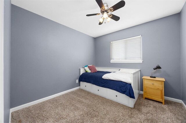 bedroom featuring baseboards, a ceiling fan, and carpet flooring