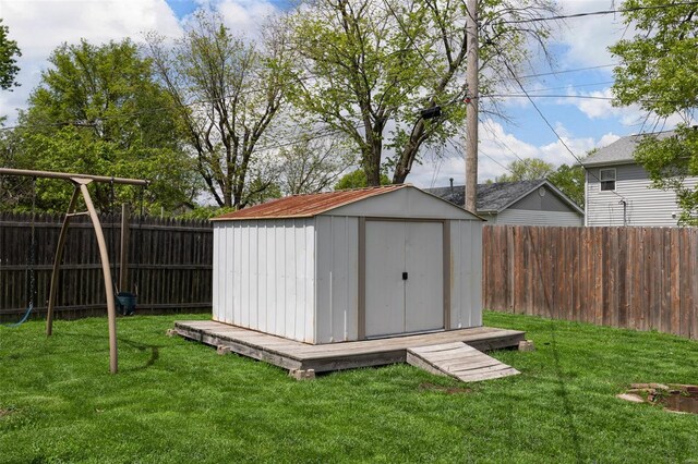 view of shed with a fenced backyard