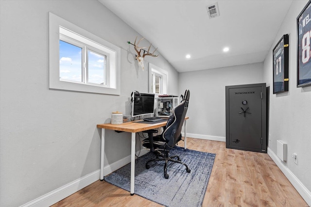 office space with recessed lighting, baseboards, visible vents, and light wood-type flooring