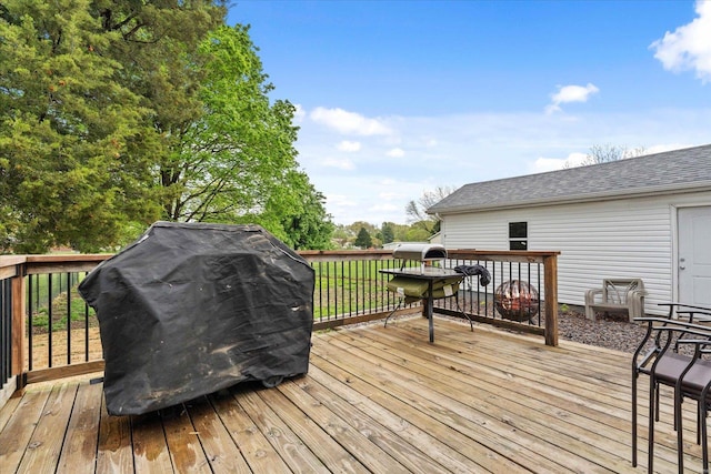 deck featuring a grill