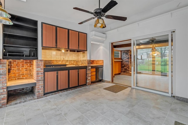 kitchen with baseboards, decorative backsplash, a wall unit AC, and a ceiling fan