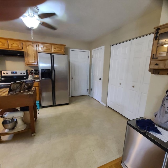 kitchen featuring appliances with stainless steel finishes and under cabinet range hood
