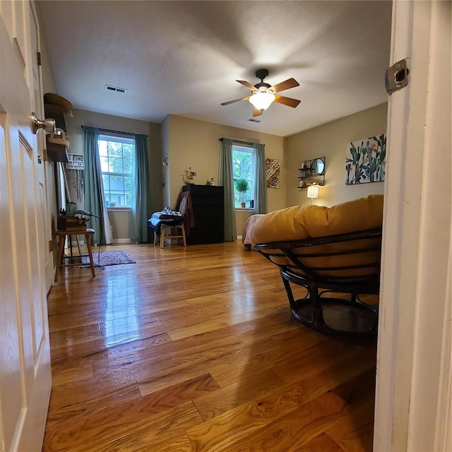 interior space with visible vents and wood finished floors