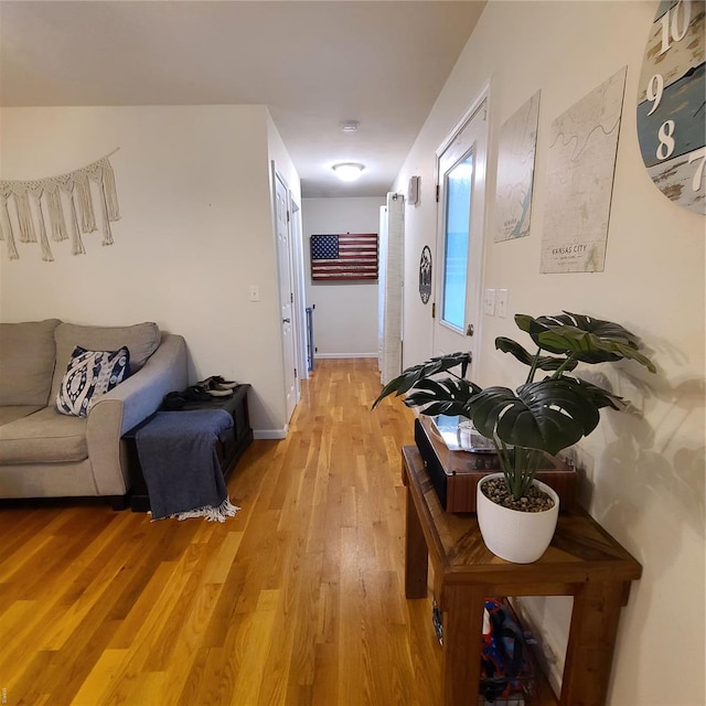 hall with light wood-style floors