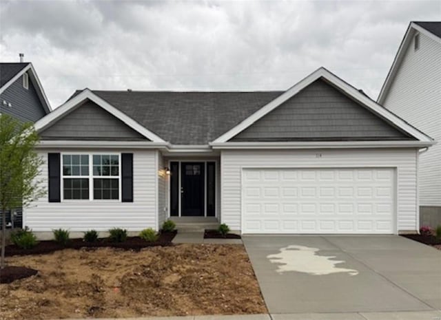 ranch-style home with a garage and concrete driveway
